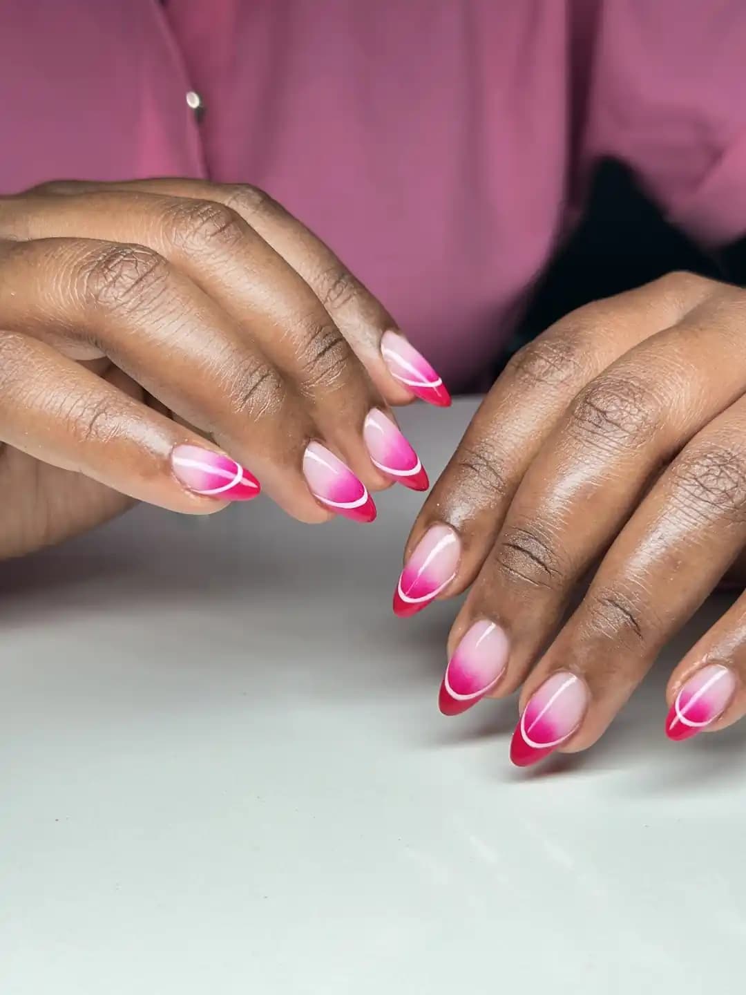 Gel extension treatment with hot pink ombre almond nails