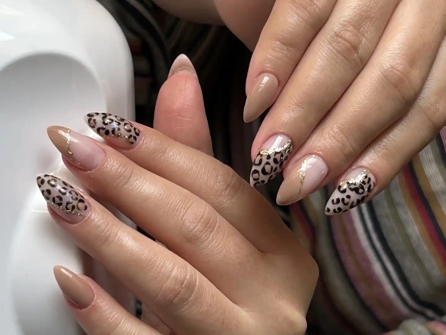 Russ Nails manicure detail in a softly lit studio