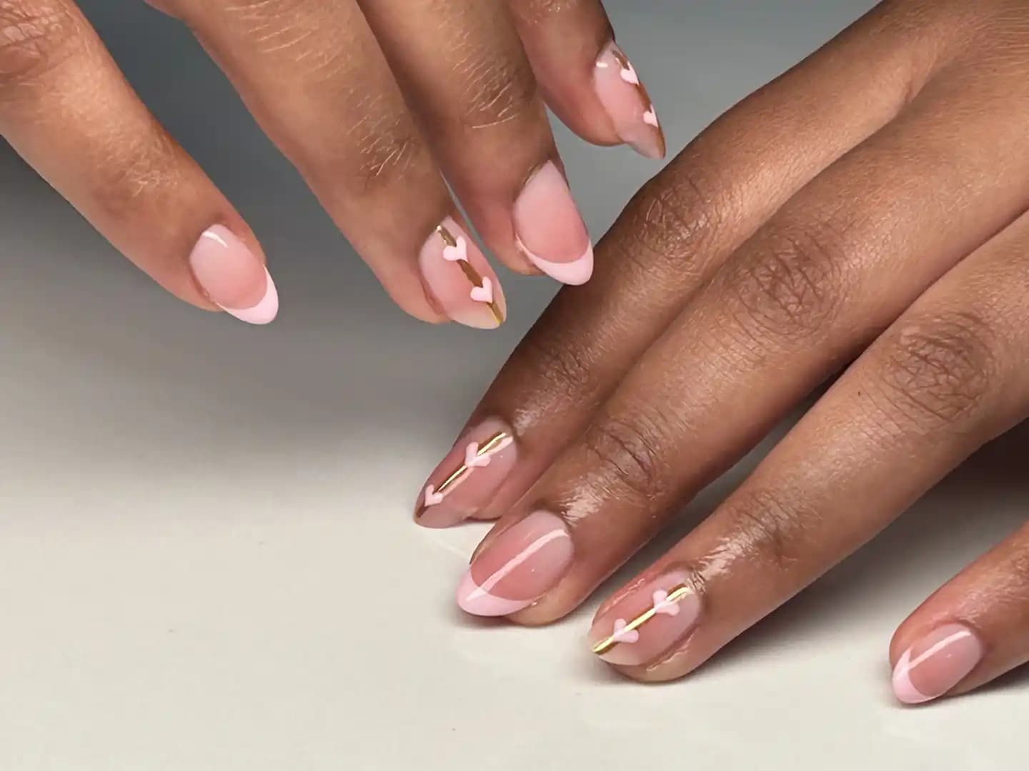 Pink french heart nail design